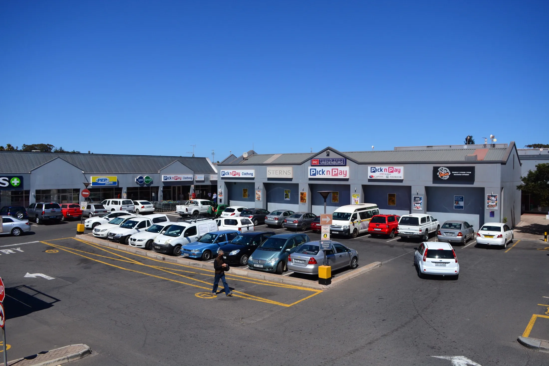 Ipic Shopping Centre Vredenburg from Main Road: the gabled shopfronts of Clicks, PEP and Pick n Pay behind the parking court.